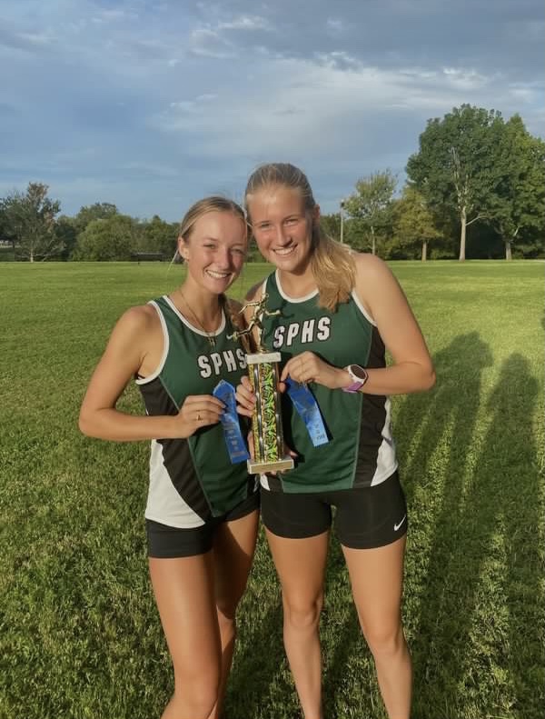 2021: Avery Lazzara (left) and Anna Cubito (right) at their cross country meet.
