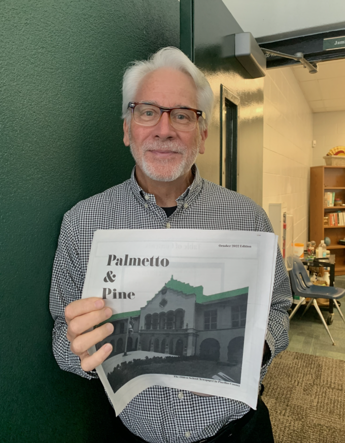 Mr. Day loves to read the SPHS Palmetto & Pine newspaper!