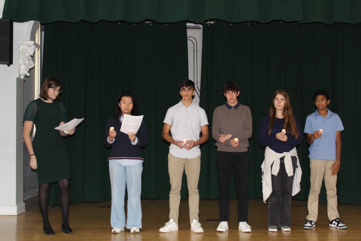 Students being inducted into the French Honor Society